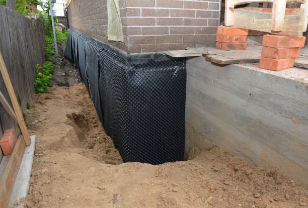 Happy homeowners after waterproofing job in Pleasant Grove